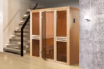Weka Elementsauna Kaarina 2 GT für 2 Personen Außenmaß (Breite x Tiefe): 177 x 194 cm Fronteinstieg Sehr gut für Nischen geeignet Wandelemente aus naturbelassenem Fichtenholz Premium-Ganzglastür aus 8 mm starkem Sicherheitsglas in Graphit-Optik, rechts oder links anschlagbar Höhe 199 cm Mindestraumhöhe 210 cm Inkl. Ofenschutz, Bodenmatte, 2 Liegen 55 cm tief, 2 Fußhocker, 2 Kopfstützen Tipp: Unter folgendem Link finden Sie unseren Kaufberater, der Ihnen erklärt, welches Zubehör für Ihren Saunakauf erforderlich ist und welches Zubehör Sie optional wählen können, um ein optimales Saunaerlebnis zu erhalten. Mit unseren ausführlichen Sauna-Montagevideos (siehe Sauna Aufbau Videos) gelingt Ihnen der Aufbau garantiert! Unser Profi-Monteur erklärt jeden einzelnen Arbeitsschritt, sodass keine Fragen offen bleiben. Die Videos zeigen den beispielhaften Aufbau einer Massivholzsauna (am Beispiel einer Karibu Sauna Mia) sowie den Aufbau einer Elementsauna (am Beispiel einer Weka Sauna Sara). Der Aufbau ist bei jeder Sauna nahezu identisch. Auch der Anschluss von Ofen und Steuergerät werden von unserem Profi-Monteur in einem Video erläutert (am Beispiel eines Karibu Bio Kombiofens).  Außenmaß (Breite x Tiefe)	177 x 194 cm Innenmaß (Breite x Tiefe)	162 x 179 cm Höhe 	199 cm Mindestraumhöhe	210 cm Wandstärke	68 mm Material	Ausgesuchtes nordisches Holz Ausführung	Naturbelassen Tür	Exklusive Ganzglastür in Graphit-Optik mit 2-Punkt-Magnetverschluss und Beschlägen in matt-chrom Design Rechts oder links anschlagbar Türgriff	Premium Edelstahlgriff Fensterelemente	2 Elemente inkl., Graphit-Optik Grundausstattung	 2 stabile Liegen (55 cm tief) 2 Kopfstützen 2 Fußbänke 1 Ofenschutzgitter aus Fichtenholz 1 hygienische Bodenmatte  Ofen	Sie haben die Wahl aus folgenden Ofensets (alle Sets enthalten Saunasteine sowie eine Steuerung):  Klassischer Saunaofen 4,5 kW mit Steuergerät (Ofenset 2)  Klassischer Saunaofen 7,5 kW mit Steuergerät (Ofenset 3)  BioAktiv Saunaofen 4,5 kW mit Dampfbadfunktion inkl. Steuergerät (Ofenset 6)   BioAktiv Saunaofen 7,5 kW mit Dampfbadfunktion inkl. Steuergerät (Ofenset 7)   Kompakt-Saunaofen 5,4 kW mit integrierter Steuerung (Ofenset 10)  Silikonkabelbedarf	Für den Anschluss des Saunaofens an den Starkstrom-Hausanschluss wird ein 5 x 2,5 mm² Silikonkabel benötigt (optional erhältlich – siehe Reiter 'Zubehör').  Das Kabel zwischen Steuergerät und Saunaofen ist inklusive (bei Öfen mit externer Steuerung). Spiegelverkehrter Aufbau möglich?	Nein Montage	Montage zum günstigen Festpreis möglich oder Sorglos-Paket mit Montage und besonderen Service-Leistungen zum Festpreis Weitere Informationen Optionale Erweiterungen (siehe Reiter "Zubehör"):   Zubehör-Set aus Edelstahl Sauna-Leuchten-Set Sternenhimmel Saunadüfte und Aufgusskonzentrate Thermo- und Hygrometer, Sanduhren, Schöpfkellen, Aufgusskübel usw. Montageanleitung	 Weka EL-Sauna Kaarina 2 GT - Montageanleitung Weka EL-Sauna Kaarina 2 GT - Ergänzung zur Montageanleitung  TechnischeDaten	 Weka EL-Sauna Kaarina 2 GT - Technische Daten – Bild 9
